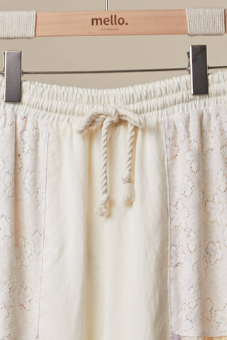 Floral Patchwork Ruffle Pant – Flowy Boho Pants with Asymmetrical Hem